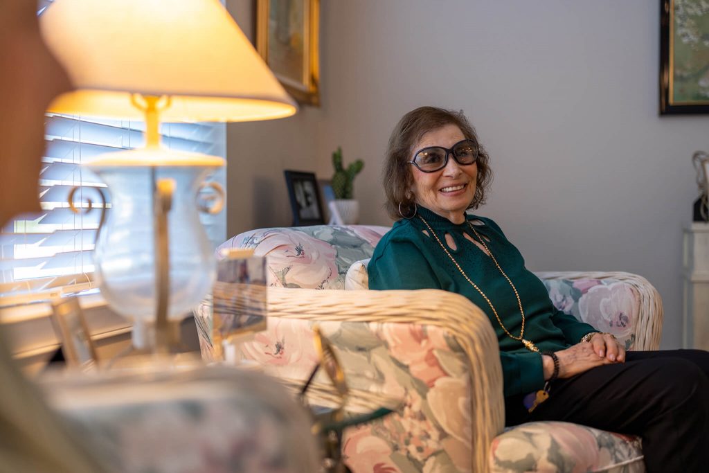 woman sitting on her couch